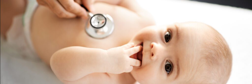 Baby being examined by doctor